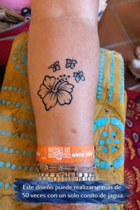 Butterfly jagua tattoo on a person's arm with a colorful background